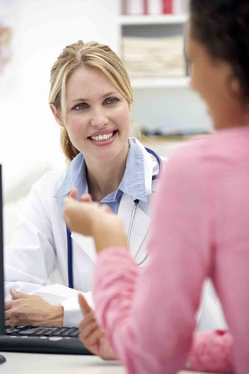 a female patient in conversation with a female doctor
